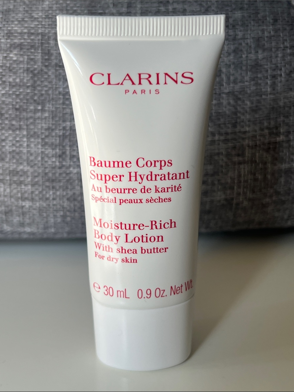 Clarins Moisture-Rich Body Lotion — White with Pink Text